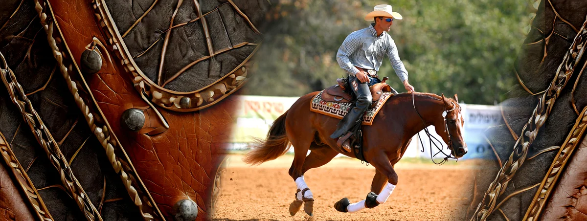 A western rider and reining horse working in an arena.